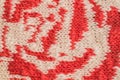 Macro color image of red and white knitted texture.