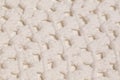 Macro color image of white knitted texture.