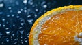 A macro commercial shot captures the vibrant texture and water drops on a fresh orange slice against a dark Royalty Free Stock Photo