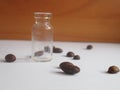 Macro composition with empty glass container and coffee beans