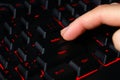 The macro of computer keyboard with finger pressing enter key Royalty Free Stock Photo