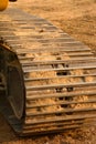 macro of the continuous tracks of a big bulldozer