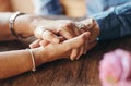 Macro, couple and elderly people holding hands on table for support, love and care in home. Zoom, senior and hand Royalty Free Stock Photo