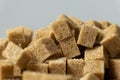 Macro cubes of brown cane unrefined demerara sugar. Royalty Free Stock Photo