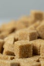 Macro cubes of brown cane unrefined demerara sugar. Royalty Free Stock Photo