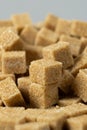 Macro cubes of brown cane unrefined demerara sugar. Royalty Free Stock Photo