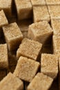 Macro cubes of brown cane unrefined demerara sugar. Royalty Free Stock Photo