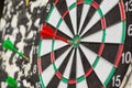 Macro darts in the center of the target, shallow DOF