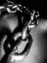 Macro detail of black and white chains from below intertwined with each other