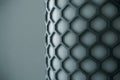 Macro detail of a hexagonal honeycomb pattern on a cylindrical object, modern abstract texture Royalty Free Stock Photo