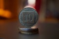 Macro detail of a metal Israeli coin & x28;10 Shekels, ten ILS& x29; on the top of column created of coins Royalty Free Stock Photo