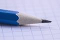 Macro detail of a pencil graphite on a piece of paper in a cage. Royalty Free Stock Photo