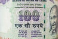 Macro detail on indian 100 Rupee bill