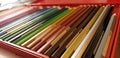 Macro display alignment of colored pencils in neatly ordered assortment