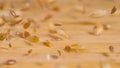 MACRO: A mix of wheat, sesame and flax seeds gets scattered across the table.