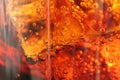 Macro drink kvass Coca-Cola with ice close-up bubbles in drink soda on a dark black background Royalty Free Stock Photo