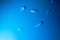 Macro drops on a blue rubber background, soft focus Royalty Free Stock Photo