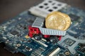 Macro Dump Truck On Computer Motherboard. Dumping Gold Bitcoin