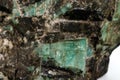Macro emerald stone mineral in rock on white background Royalty Free Stock Photo