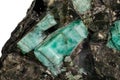 Macro emerald stone mineral in rock on white background Royalty Free Stock Photo