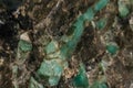 Macro emerald stone mineral in rock on white background Royalty Free Stock Photo