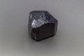 Macro-focused raw natural black tourmaline schrol crystal