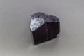 Macro-focused raw natural black tourmaline schrol crystal