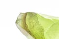 Macro focused raw shiny semi-transparent light lime green, pistachio calcite stone Royalty Free Stock Photo