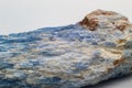 Macro focused raw uncut vibrant blue kyanite crystal
