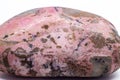 Macro focused tumbled and polished pink rhodonite crystal