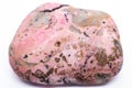 Macro focused tumbled and polished pink rhodonite crystal