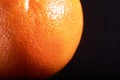macro fresh orange peel on a black background. Royalty Free Stock Photo