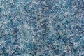 Macro frost.Icy frost, white crystals of frost on a blue background.Abstract texture of frost