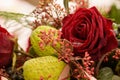 Macro on frozen red roses. Funeral arrangement covered in snow. Royalty Free Stock Photo