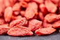 Macro of goji berries on stone plate Royalty Free Stock Photo