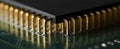 Macro gold microprocessor pin array on green circuit board background Royalty Free Stock Photo