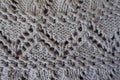 Macro of gray handmade zigzag knitted openwork