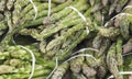 Closeup of bunches of green asparagus at a food market Royalty Free Stock Photo