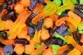 Macro halloween gummy worms witches brooms cats candy Royalty Free Stock Photo