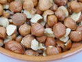 Macro hazelnuts kernel in a ceramic bowl