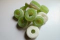 Macro of heap of green and white jelly ring candies