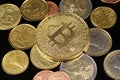 A close up image of Euro coins with a Bitcoin on a black background Royalty Free Stock Photo