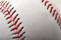 Macro image of a baseball with the closeup on the stitches with copy space