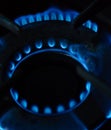 A Macro Image of a Blurry Blue Flames on Gas Stove Burner Royalty Free Stock Photo