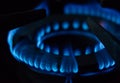 A Macro Image of a Blurry Blue Flames on Gas Stove Burner Royalty Free Stock Photo