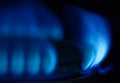 A Macro Image of a Blurry Blue Flames on Gas Stove Burner Royalty Free Stock Photo
