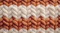 Macro image of a close-up texture of a knitted pattern, white, cream and orange colors filling the frame