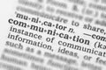 Macro image of dictionary definition of communication