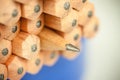 Macro image of graphite tip of a sharp ordinary wooden pencil as drawing and drafting tool, standing among other pencils