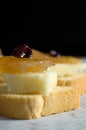 Macro Image of Mini Toast with Cheese, Caramelized Apple and Raisin